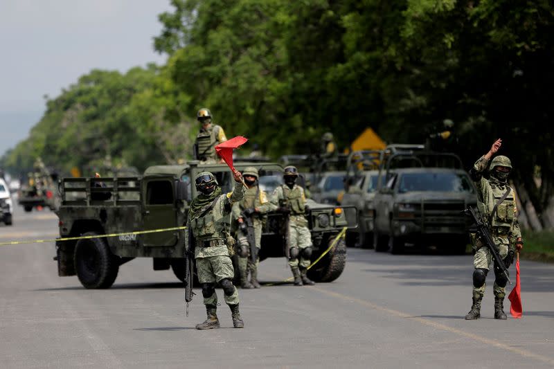 FILE PHOTO: Members of the National Guard are seen at a military check point after Mexican security forces captured Jose Antonio Yepez known as "El Marro" (The Mallet) in Santa Cruz de Juventino Rosas