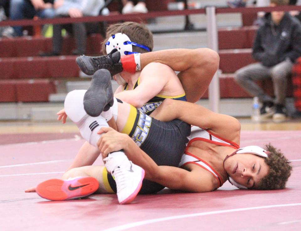 Newark senior Jibreel Smith wrestles Olentangy sophomore Jake Piontkowski in the 126-pound final during the Division I sectional championships at Newark on Saturday, Feb. 25, 2023. Smith won the match 7-3.