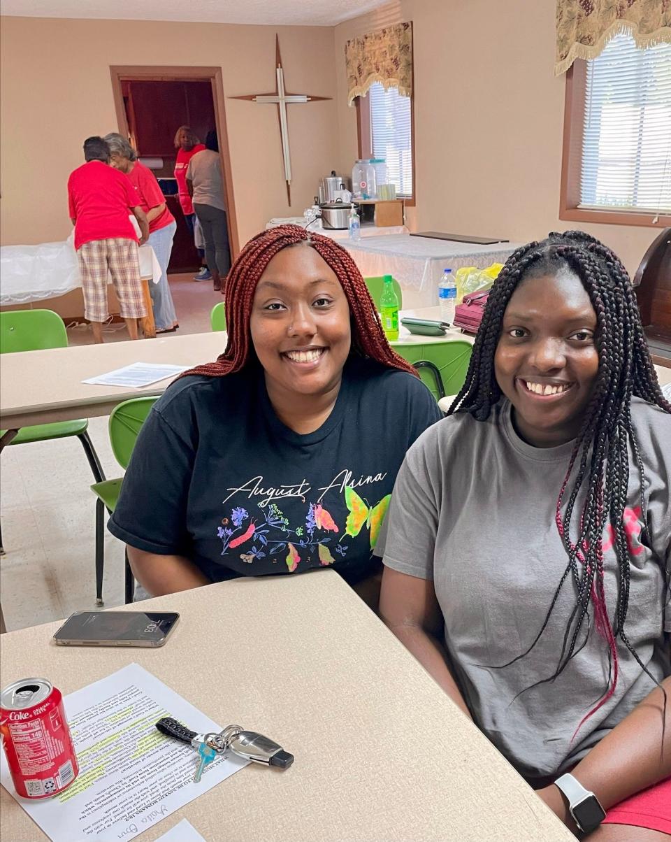 Laila Orr, left, and her cousin, Destini Jones, are part of the future generation that motivates Timothy "Cas" Smith and his elders to work to preserve local Black history in Collinsville, Alabama. The two girls are granddaughters of Julia Orr, a former student at Gregory High School.