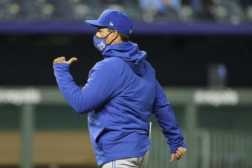 Toronto Blue Jays manager Charlie Montoyo walks back to the dugout after making a pitching change during the fourth inning of a baseball game against the Kansas City Royals, Thursday, April 15, 2021, in Kansas City, Mo. (AP Photo/Charlie Riedel)