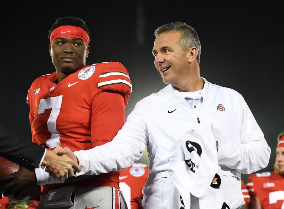 Dwayne Haskins and Ohio State coach Urban Meyer on the podium after defeating Washington in the 2019 Rose Bowl.