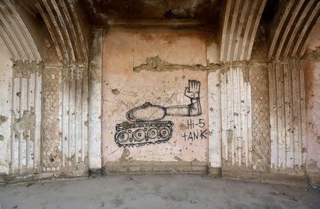Graffiti is seen on a wall of the Darul Aman palace in Kabul, Afghanistan, June 5, 2016. REUTERS/Omar Sobhani