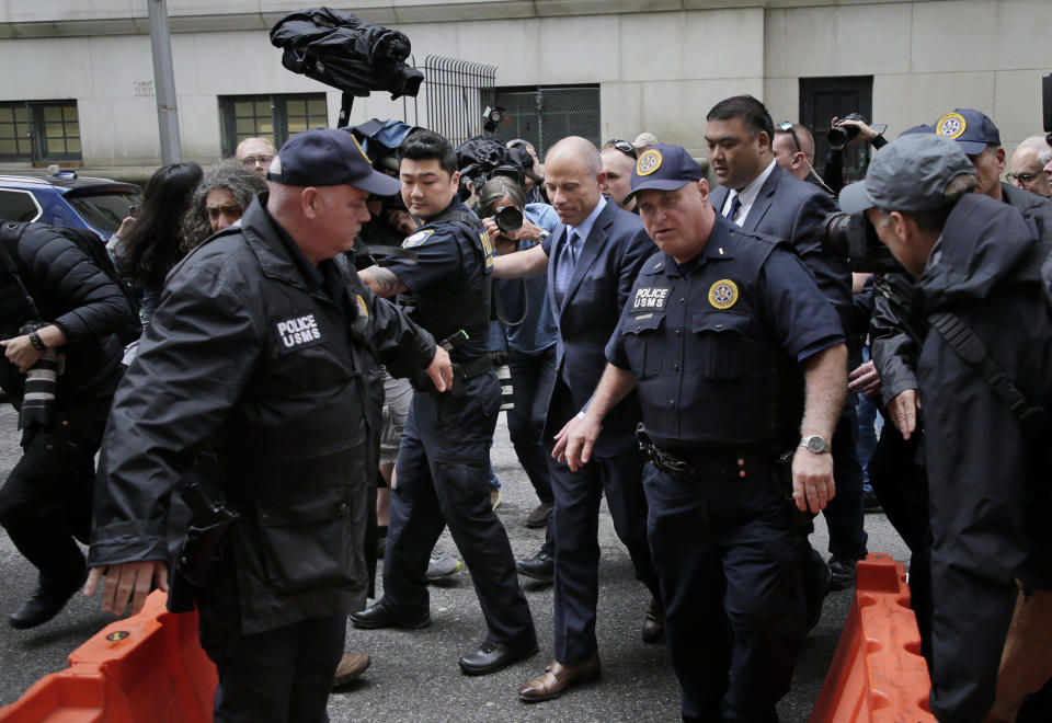 Michael Avenatti, center, is surrounded by media and security, enters a courthouse in New York, Tuesday, May 28, 2019, for a hearing where he pleaded not guilty to charges that he defrauded his most famous client, porn star Stormy Daniels. (AP Photo/Seth Wenig)