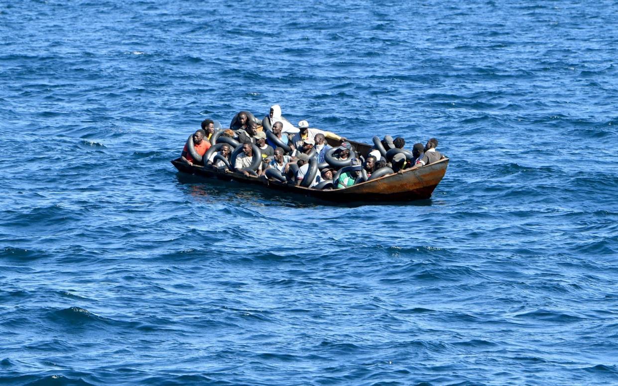 Crammed mirgant boat in middle of sea