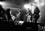 <p>Kurt Cobain sings into the mic during the band's performance at Paradiso in Amsterdam on November 25, 1991. </p>