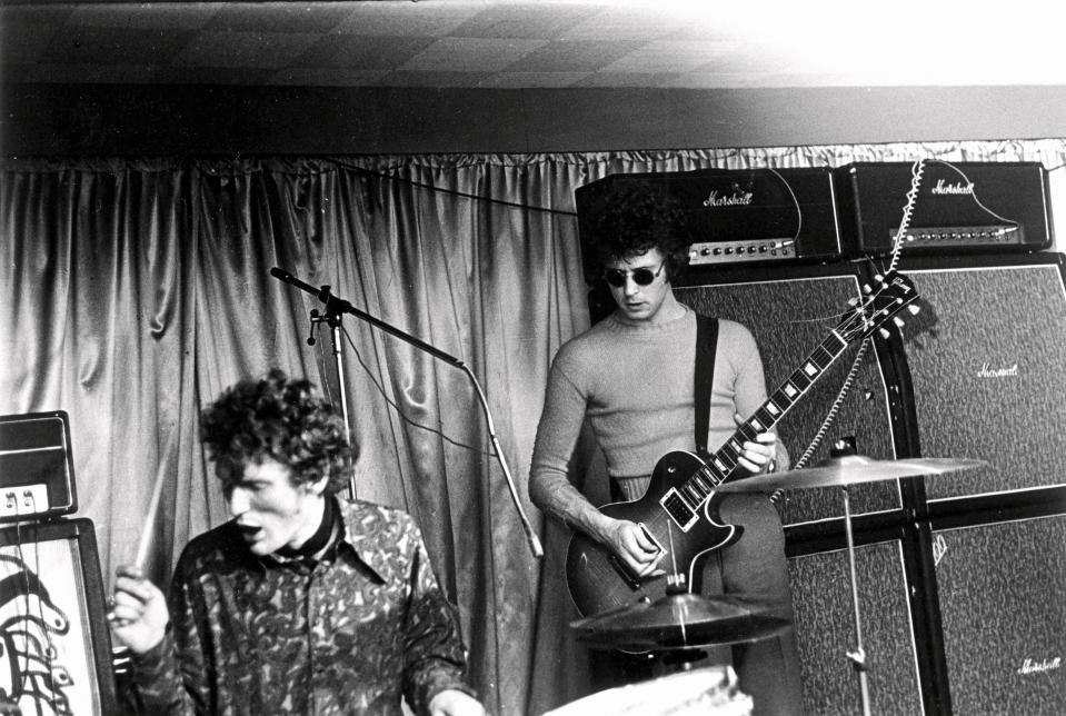 Drummer Ginger Baker and guitarist Eric Clapton of British band Cream perform on stage at the Starlight Ballroom in Greenford, London in 1967. (Photo by Michael Putland/Getty Images)