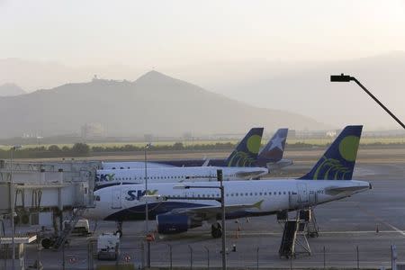 Airplanes are seen parked on the tarmac at the international airport of Santiago, Chile December 17, 2015. REUTERS/Carlos Vera