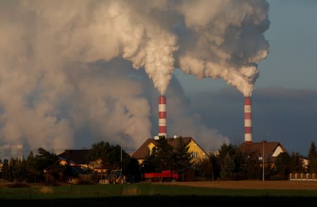 Smoke and steam billows from coal-fired power plant near Belchatow