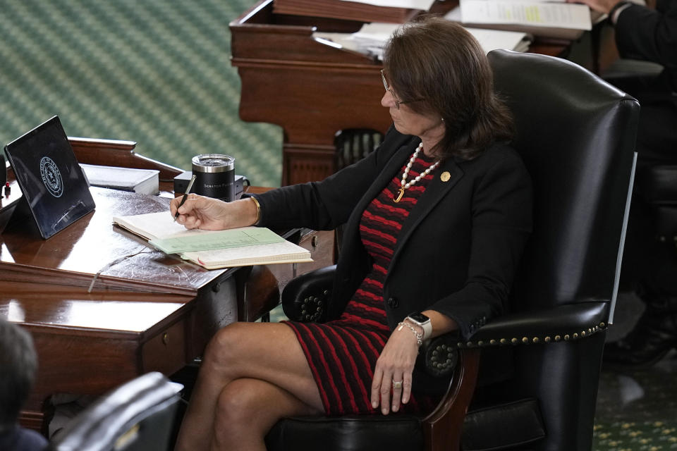 State Sen. Angela Paxton, R-McKinney, wife of suspended Texas state Attorney General Ken Paxton, keeps track of voting in his impeachment trial at the Texas Capitol, Saturday, Sept. 16, 2023, in Austin, Texas. (AP Photo/Eric Gay)