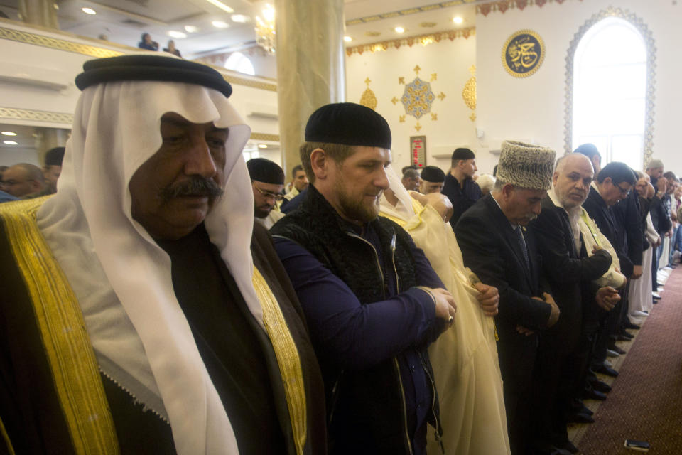 Chechen President Ramzan Kadyrov, second left, prays inside a new mosque, partially funded by Chechnya in the Arab village of Abu Ghosh, on the outskirts of Jerusalem, Sunday, March 23, 2014. Isa Jabar, the mayor of the village says some Abu Ghosh residents trace their ancestry to 16th century Chechnya and the Caucus region. Speaking at the dedication ceremony Sunday Kadyrov said it was an honor to visit “this good and holy land.” (AP Photo/Sebastian Scheiner)