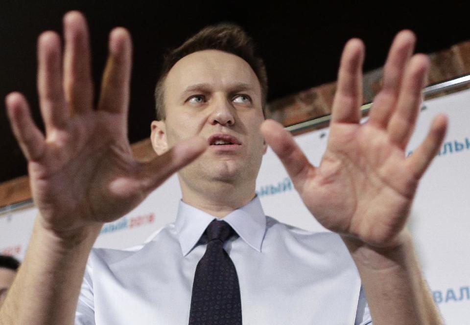 FILE - In this file photo taken on Saturday, Feb. 4, 2017, Russian opposition leader Alexei Navalny gestures at a news conference in his campaign office in St. Petersburg, Russia. A court in a provincial Russian city has found opposition leader Alexei Navalny guilty in the retrial of a 2013 fraud case, which means that he cannot run for president next year. (AP Photo/Elena Ignatyeva)