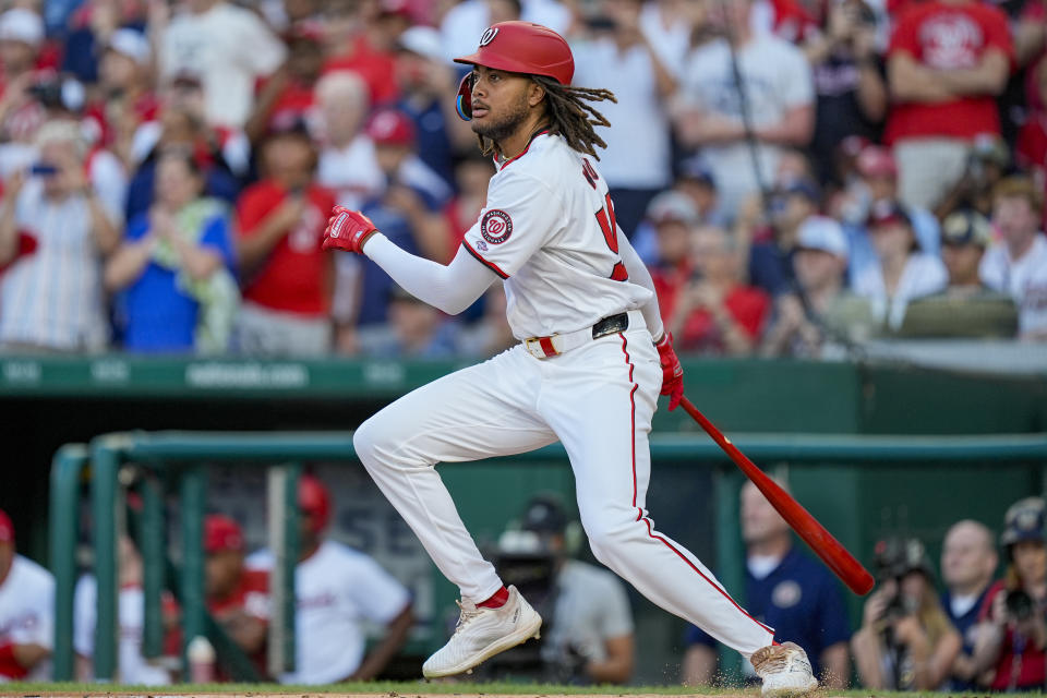 Washington Nationals' James Wood drops his bat as he hits a single in his first major league at-bat during the second inning of a baseball game against the New York Mets at Nationals Park, Monday, July 1, 2024, in Washington. (AP Photo/Alex Brandon)