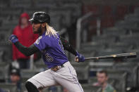 Colorado Rockies pinch-hitter Raimel Tapia watches his single that drove in the go-ahead run in the 10th inning of the team's baseball game against the Atlanta Braves on Wednesday, Sept. 15, 2021, in Atlanta. (AP Photo/John Bazemore)