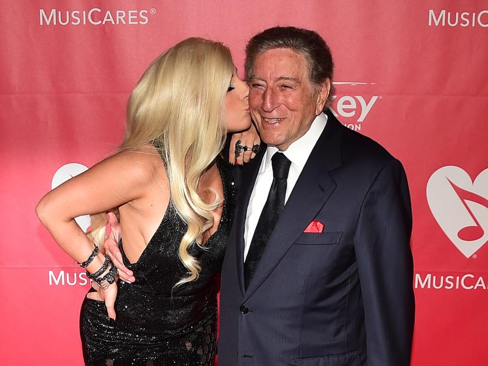 Lady Gaga and Tony Bennett pose on their red carpet arrival for the 2015 MusiCares Person of the Year annual benefit gala dinner and concert in Los Angeles, California on February 5, 2015, which honored on the event's 25th anniversary Bob Dylan.