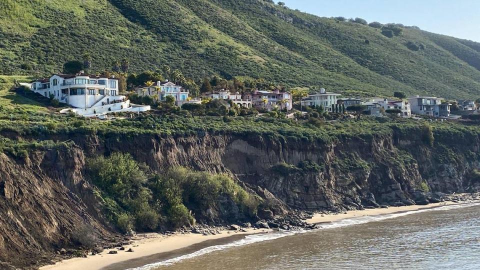 Bluffs below houses at Pirate’s Cove show significant slumping after a winter of heavy rains and storm surge as seen here with rocks reaching the tide line on May 16, 2023.