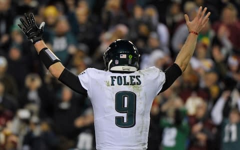 Philadelphia Eagles quarterback Nick Foles (9) reacts to wide receiver Nelson Agholor's touchdown during the second half of the NFL football game against the Washington Redskins - Credit: AP