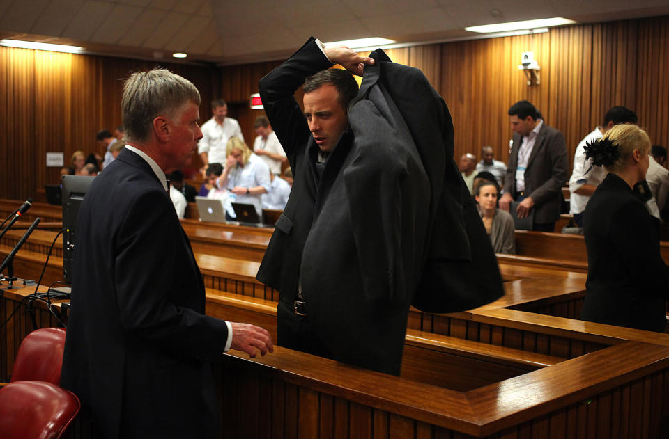 Oscar Pistorius, prepares to leave court during a recess on the third day of his trial at the high court in Pretoria, South Africa, Wednesday, March 5, 2014. Pistorius is charged with murder for the shooting death of his girlfriend, Reeva Steenkamp, on Valentines Day in 2013. (AP Photo/Alon Skuy-Pool)