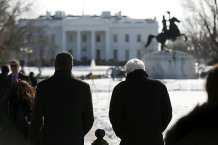 U.S. Democratic presidential candidate Bernie Sanders (R) gives an interview to Lester Holt (L) of NBC News in Lafayette Square across from the White House in Washington January 27, 2016. REUTERS/Jonathan Ernst