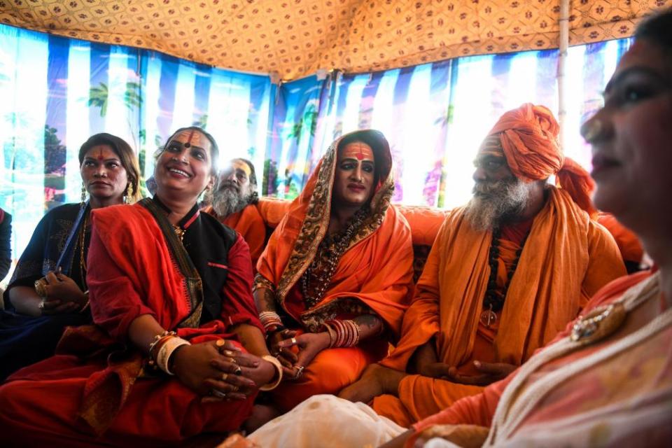 Laxmi Narayan Tripathi (C), a transgender rights activist, holds a meeting at the Kumbh Mela festival.