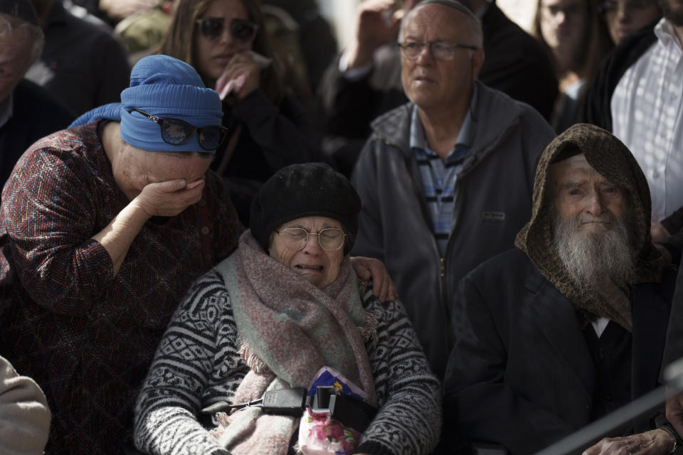 Relatives of Yitzhak Zeiger mourn during his funeral at a cemetery in Jerusalem, Israel, Friday, March 1, 2024. Two Israelis, including Zeiger, were killed in a Palestinian shooting attack at a gas station near the Jewish settlement of Eli, in the occupied West Bank on Thursday, the Israeli military said. (AP Photo/Leo Correa)