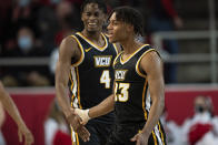 Virginia Commonwealth guard Jayden Nunn (23) celebrates with forward Jalen DeLoach (4) during the first half of an NCAA college basketball game against Davidson in Davidson, N.C., Wednesday, Jan. 26, 2022. (AP Photo/Jacob Kupferman)