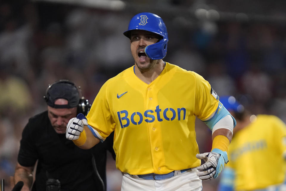 Boston Red Sox's Adam Duvall celebrates as he returns to the dugout after scoring on his home run in the eighth inning of a baseball game against the Atlanta Braves, Wednesday, July 26, 2023, in Boston. (AP Photo/Steven Senne)