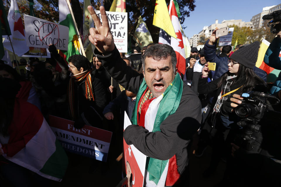 Protesters rally against the Washington visit of Turkish President Recep Tayyip Erdogan outside the White House, Wednesday, Nov. 13, 2019, in Washington. (AP Photo/Steve Helber)