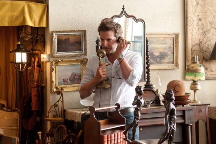 Bradley Cooper talking on a vintage phone in The Words
