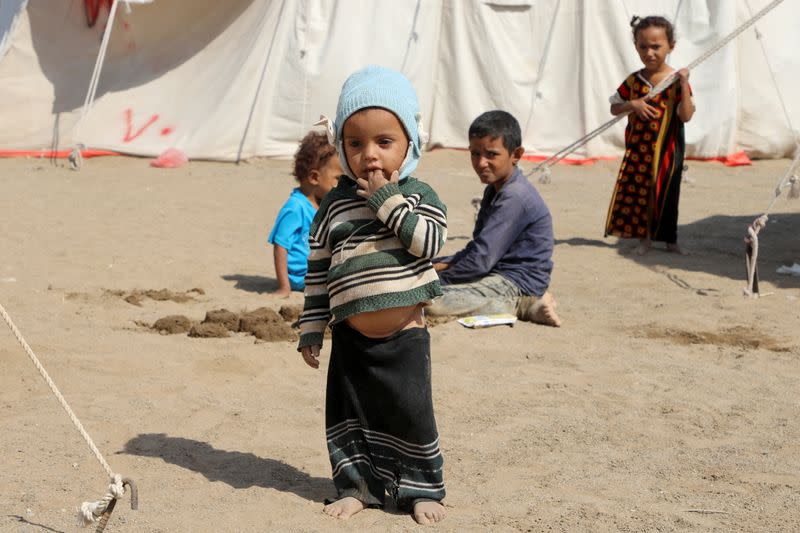 Children pass time at al-Wara camp for internally displaced people in al-Khukha of Hodeidah province