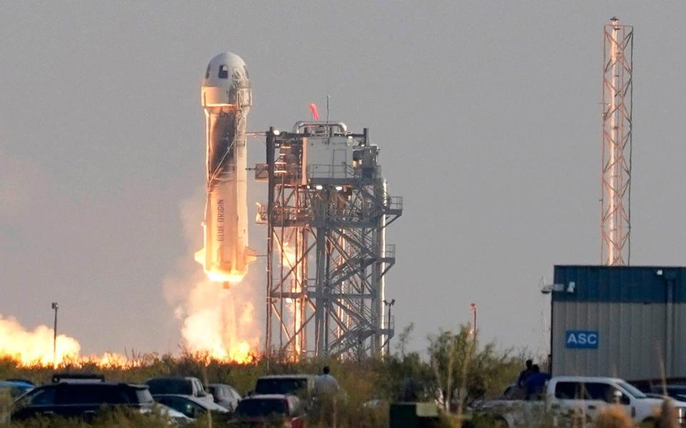 Blue Origin's New Shepard rocket launches carrying passengers Jeff Bezos - AP Photo/Tony Gutierrez