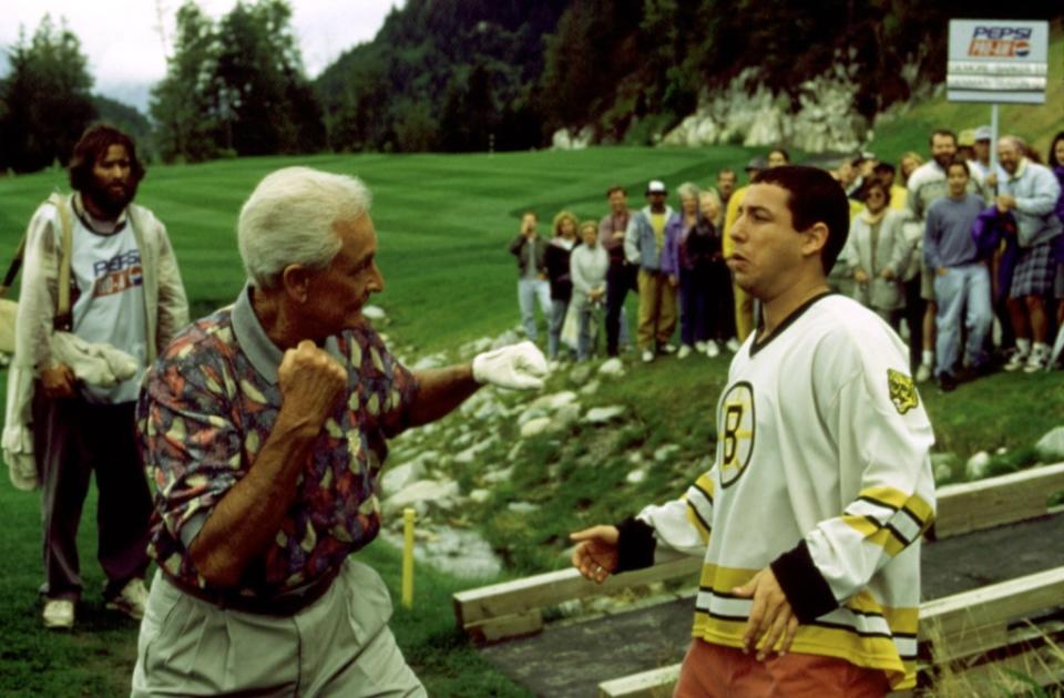 Bob Barker (as himself) and Happy Gilmore duke it out in the famous scene from “Happy Gilmore.”