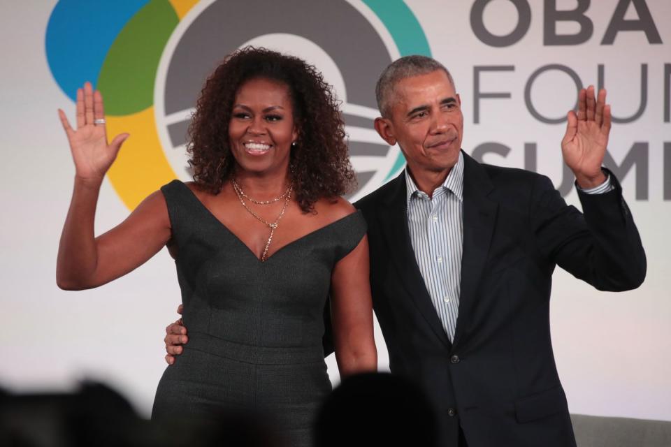 <p>Scott Olson/Getty</p> Michelle Obama, Barack Obama.