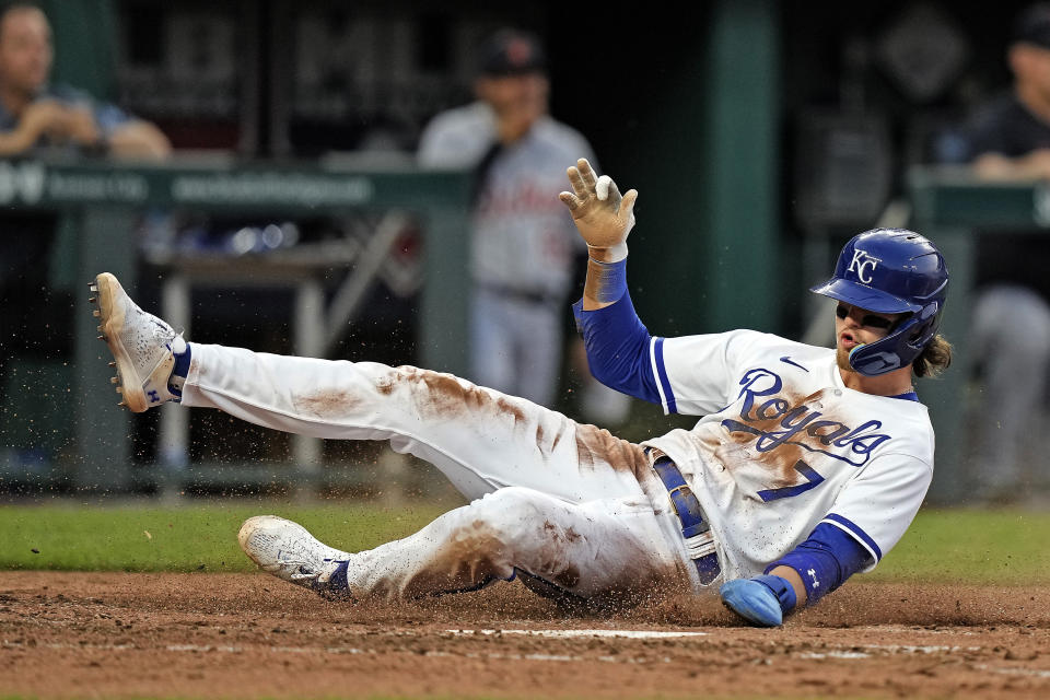 Kansas City Royals' Bobby Witt Jr. slides home to score on a single by Edward Olivares during the fifth inning of a baseball game against the Detroit Tigers Tuesday, May 23, 2023, in Kansas City, Mo. (AP Photo/Charlie Riedel)