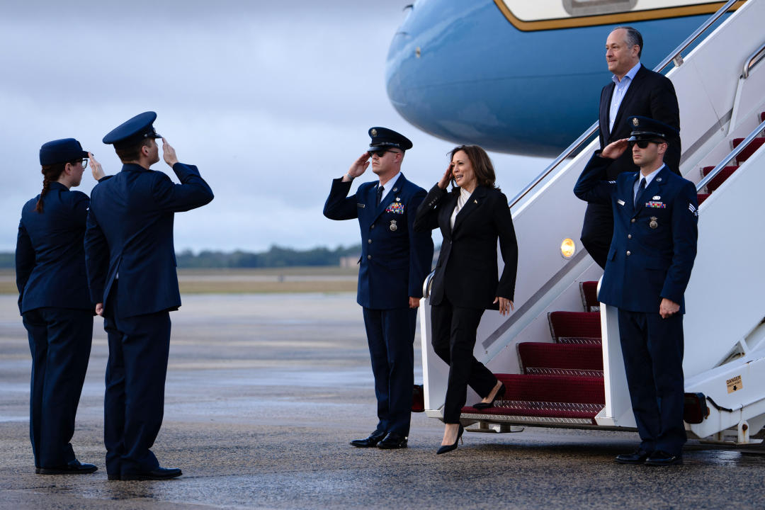 Vice President Kamala Harris salutes as she descends from Air Force Two at Delaware National Air Guard base in New Castle, Del., on Monday. (Erin Schaff/AFP via Getty Images)