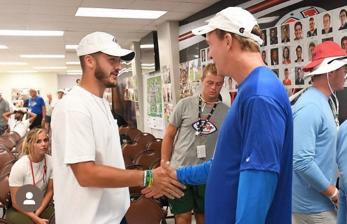 FIU quarterback Gunnar Holmberg (seen here interacting with NFL Hall of Famer Peyton Manning) spent four days this past June at the Manning Passing Academy.