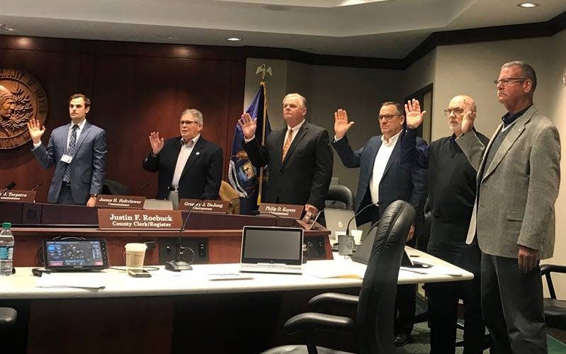 Ottawa County Clerk Justin Roebuck leads Ottawa County Board of Commissioners in the oath of office in 2019 at the Fillmore Street Complex.