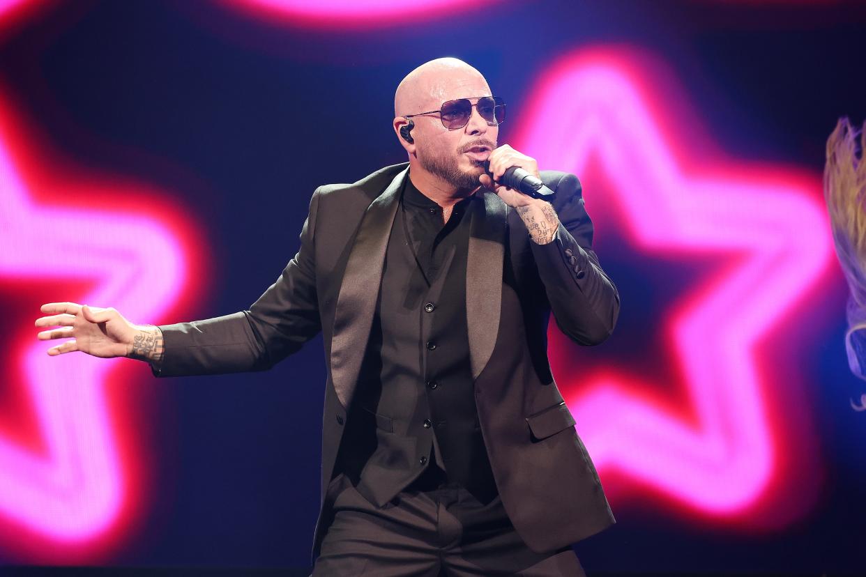 Pitbull performs during The Trilogy Tour at Capital One Arena on Oct. 14 in Washington, DC. The tour, featuring the Miami rapper alongside Spanish language stars Ricky Martin and Enrique Iglesias, arrives in Austin on Feb. 9.