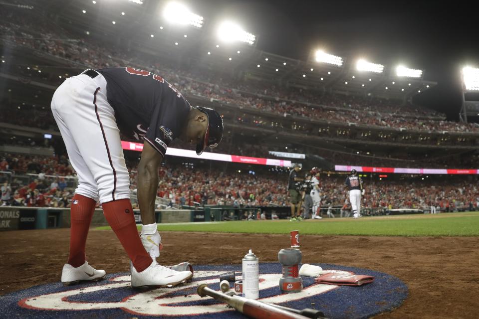 Washington Nationals' Victor Robles is seen in the on deck circle during the fourth inning of Game 3 of the baseball National League Championship Series against the St. Louis Cardinals Monday, Oct. 14, 2019, in Washington. (AP Photo/Jeff Roberson)