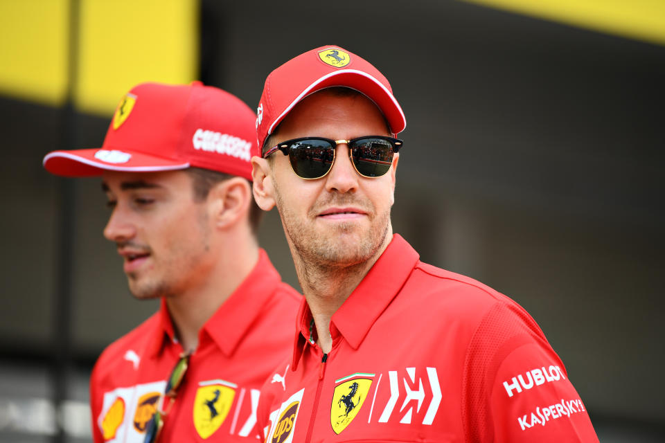 SUZUKA, JAPAN - OCTOBER 10: Sebastian Vettel of Germany and Ferrari and Charles Leclerc of Monaco and Ferrari walk in the Pitlane during previews ahead of the F1 Grand Prix of Japan at Suzuka Circuit on October 10, 2019 in Suzuka, Japan. (Photo by Clive Mason/Getty Images)