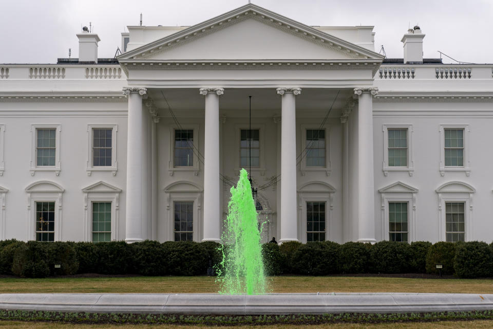 The fountain on the North Lawn of the White House is dyed green for St. Patrick's Day, Wednesday, March 17, 2021, in Washington. (AP Photo/Andrew Harnik)