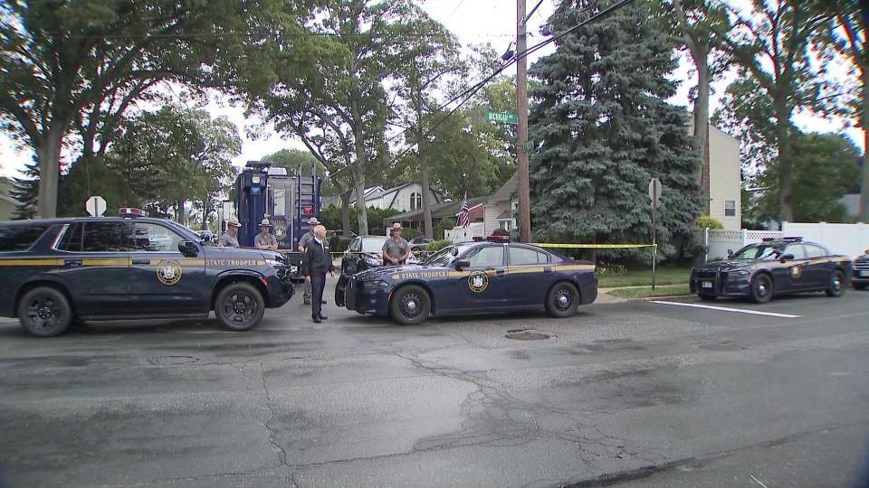 A large police presence outside a home in Massapequa Park, on Long Island, on July 14, 2021, after an arrest was made in the Gilgo Beach murders case. / Credit: CBS New York