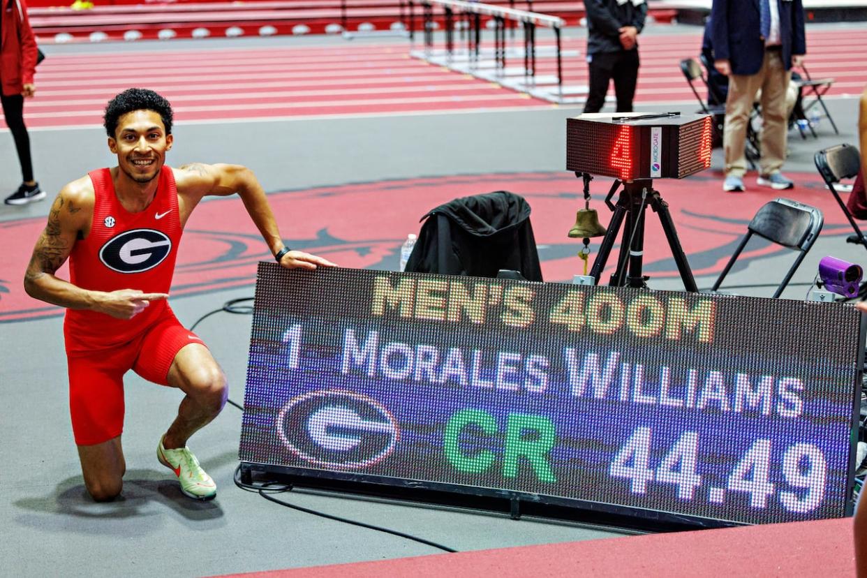 Canadian Christopher Morales Williams poses for a photo next to his result during the NCAA Southeastern Conference indoor championships in Fayetteville, Ark., on Feb. 25, 2024. (Wesley Hitt/University of Georgia/The Canadian Press - image credit)