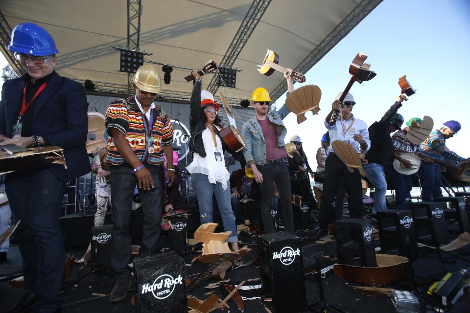 Honored guests smash guitars during the ceremonial grand opening of the Hard Rock Hotel in May 2018 in Daytona Beach.