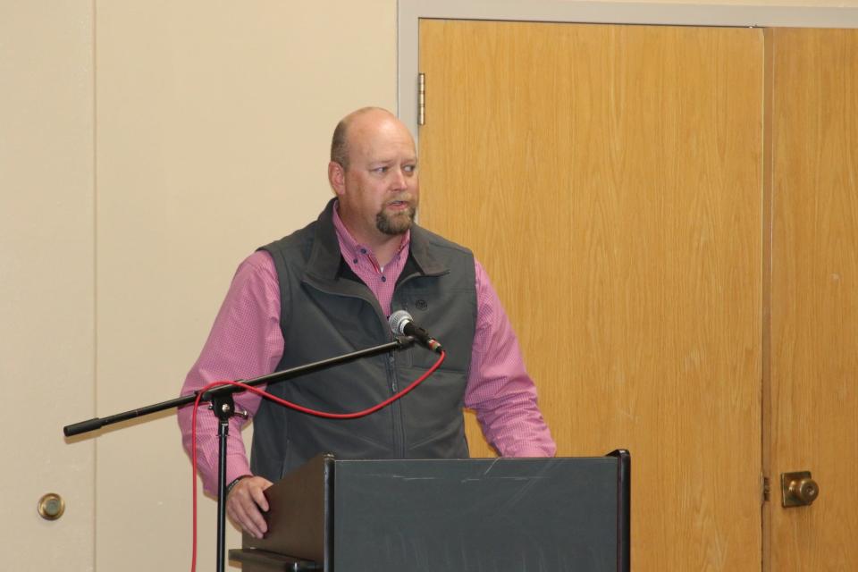 Chad Ingram, chief executive officer of the Carlsbad Chamber of Commerce, speaks during the induction of the late Janell Whitlock into the Carlsbad Hall of Fame on Dec. 29, 2023.