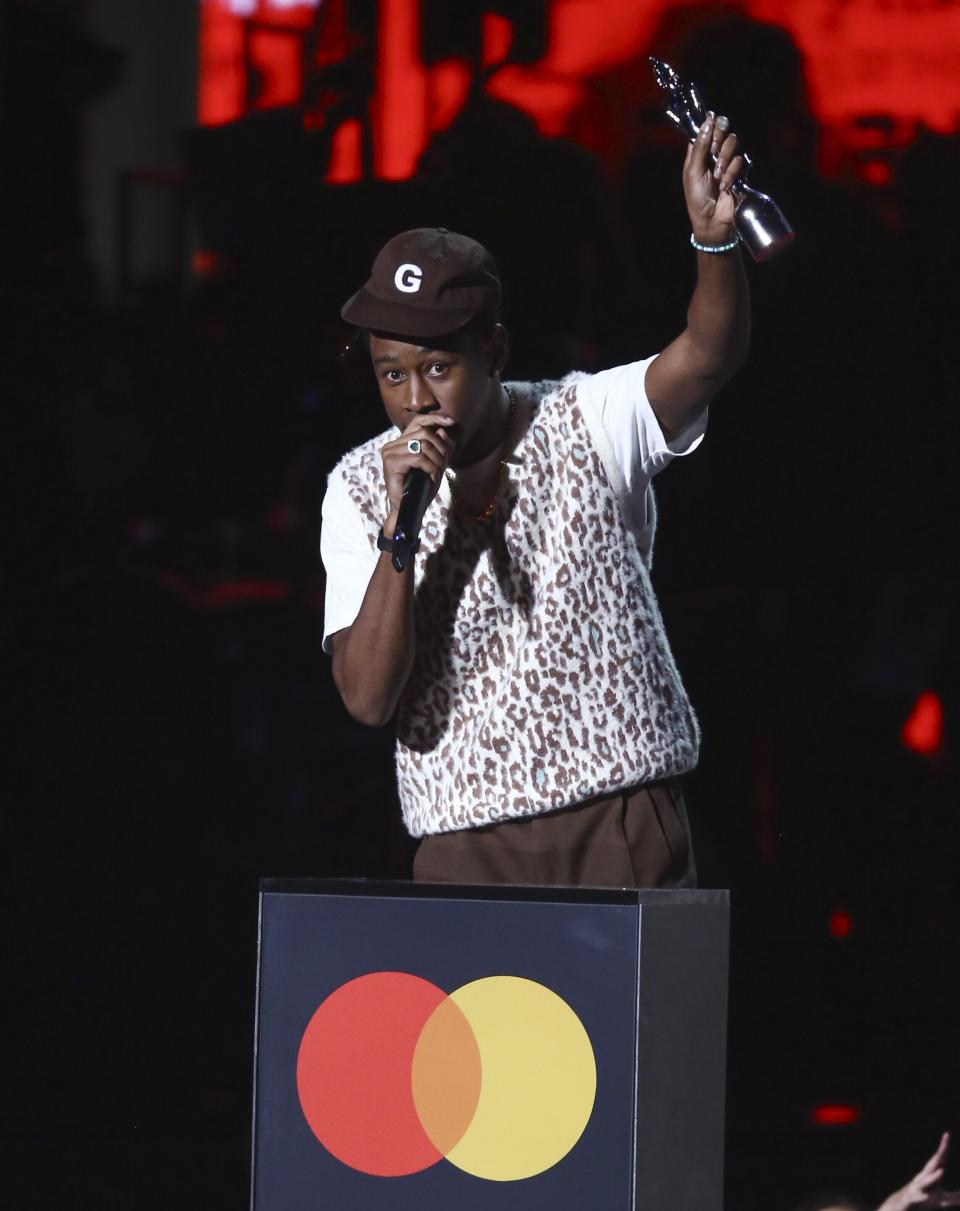 Tyler, the Creator accepts his award for International Male Solo Artist on stage at the Brit Awards 2020 in London, Tuesday, Feb. 18, 2020. (Photo by Joel C Ryan/Invision/AP)