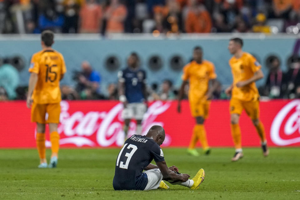 Ecuador's Enner Valencia lies on the pitch during the World Cup group A soccer match between Netherlands and Ecuador, at the Khalifa International Stadium in Doha, Qatar, Friday, Nov. 25, 2022. (AP Photo/Natacha Pisarenko)