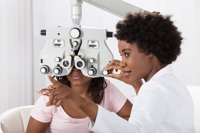 A doctor giving a patient an eye exam