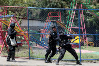 Riot police throws a sound granade towards demonstrators during a protest against Nicaraguan President Daniel Ortega's government in Managua, Nicaragua September 23, 2018. REUTERS/Oswaldo Rivas