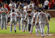ARLINGTON, TX - OCTOBER 22: The St. Louis Cardinals celebrate after defeating the Texas Rangers 16-7 in Game Three of the MLB World Series at Rangers Ballpark in Arlington on October 22, 2011 in Arlington, Texas. (Photo by Rob Carr/Getty Images)