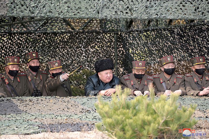 North Korea leader Kim Jong Un observes an artillery fire competition between the artillery units under the Korean People's Army Corps 7 and Corps 9 at a training ground in North Korea